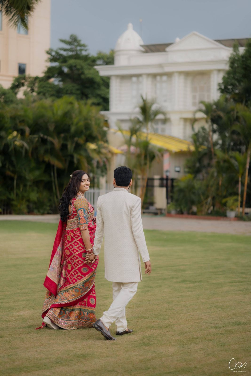 Satyam and Anshi strolling across the lawn